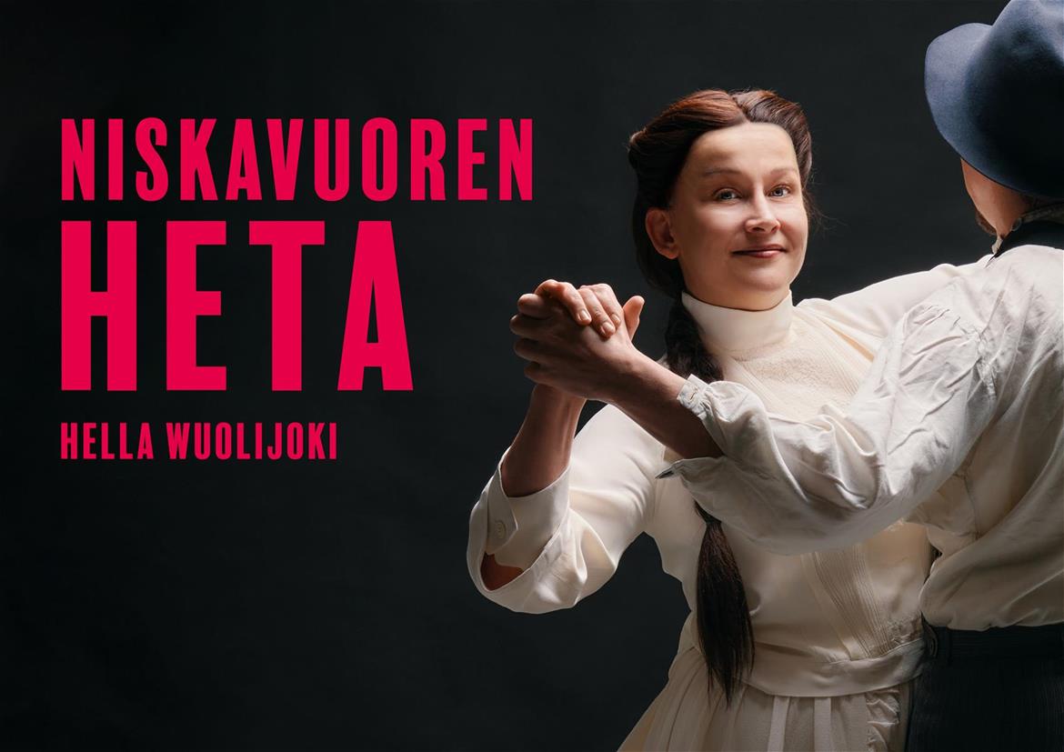 Mustalla taustalla nainen ja mies tanssimassa. Nainen katsoo suoraan kameraan, mies puolestaan on selin kameraan. Punaisella teksti: 